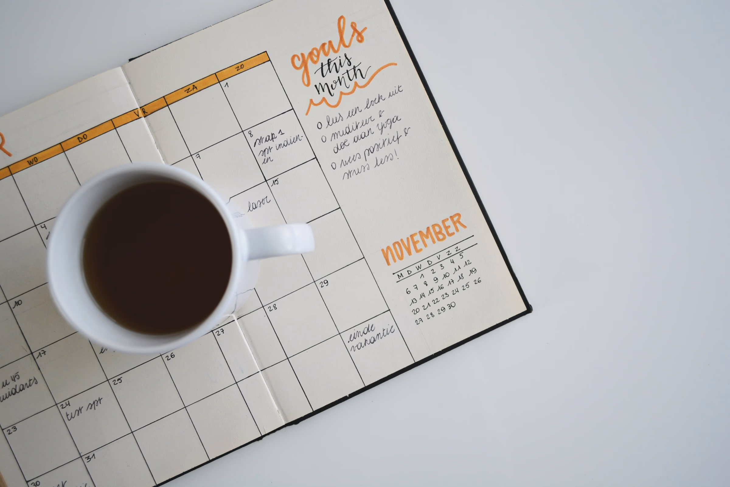 A calendar laid out on a quiet desk